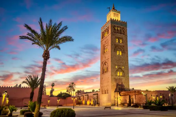 Koutoubia Mosque surrounded by palm trees in Marrakech, Morocco